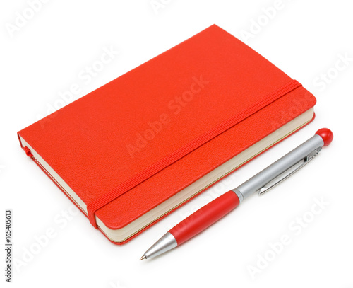 Red closed notepad  and pen isolated on white