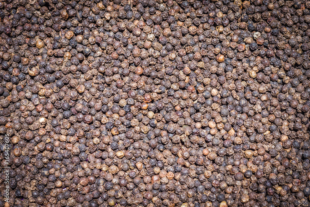 Black Peppercorns,Peppercorn Varieties. Milled black pepper.and Black pepper grains as background close up,texture,spice medicinal properties. Black Peppercorns,Peppercorn Varieties. Milled black pepper.and Black pepper grains as background close up,texture,spice medicinal properties.