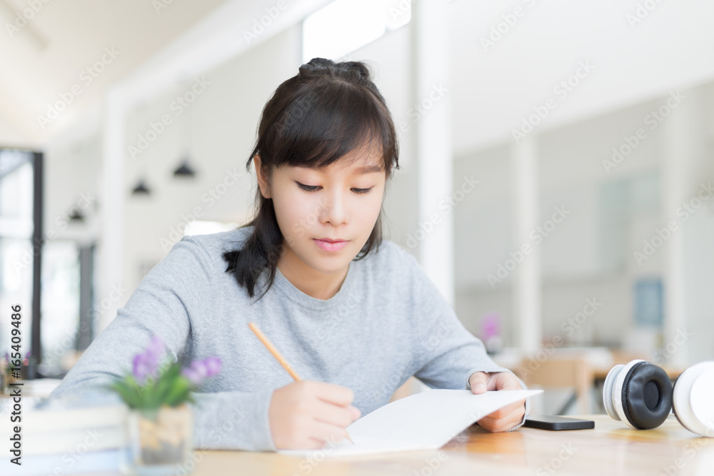 university students thinking and writing in the notebook university students thinking and writing in the notebook