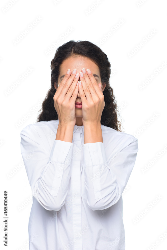 attractive businesswoman in white shirt closing face with hands, isolated on white attractive businesswoman in white shirt closing face with hands, isolated on white