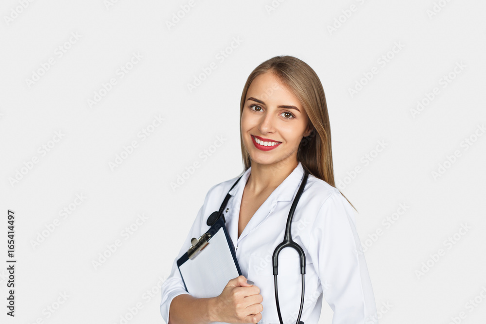 Female doctor with stethoscope holding clipboard Female doctor with stethoscope holding clipboard