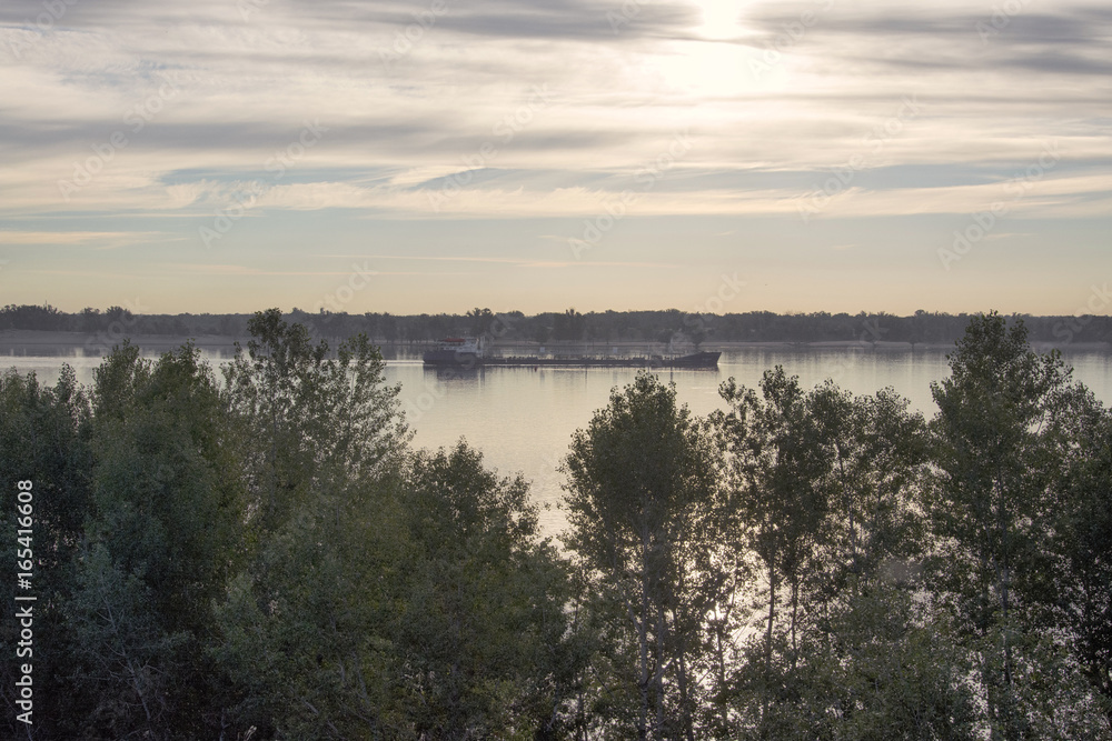 floating barge on the Volga river. the view from the top of the trees