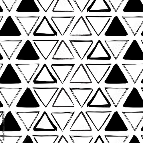 Seamless geometric ornament from handdrawn triangles. Can be used for fabrics and backgrounds