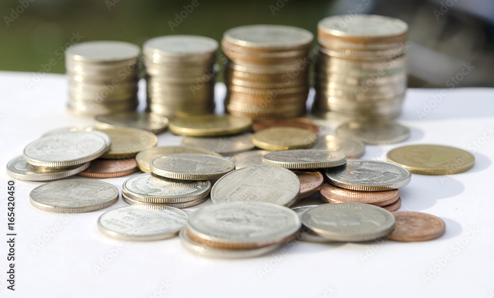 the pile of coins on white background ,Business and finance ,Victory and success from patience ,Slow economic growth the pile of coins on white background ,Business and finance ,Victory and success from patience ,Slow economic growth