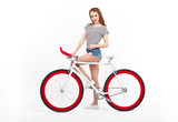 Woman posing with bicycles