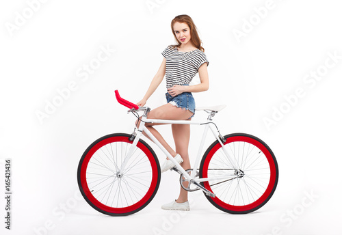 Woman posing with bicycles