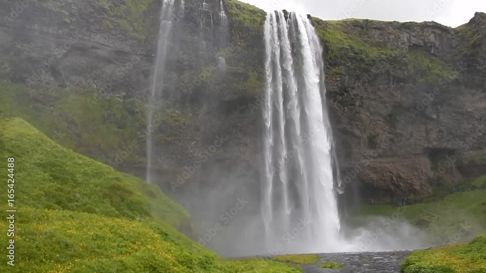 amazing Seljalandsfoss waterfall in southern iceland where you can walk behind
amazing Seljalandsfoss waterfall in southern iceland where you can walk behind