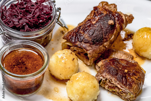 Rinderroulade nach Hausmannsart mit Rotkohl und Kartoffelklößen. photo