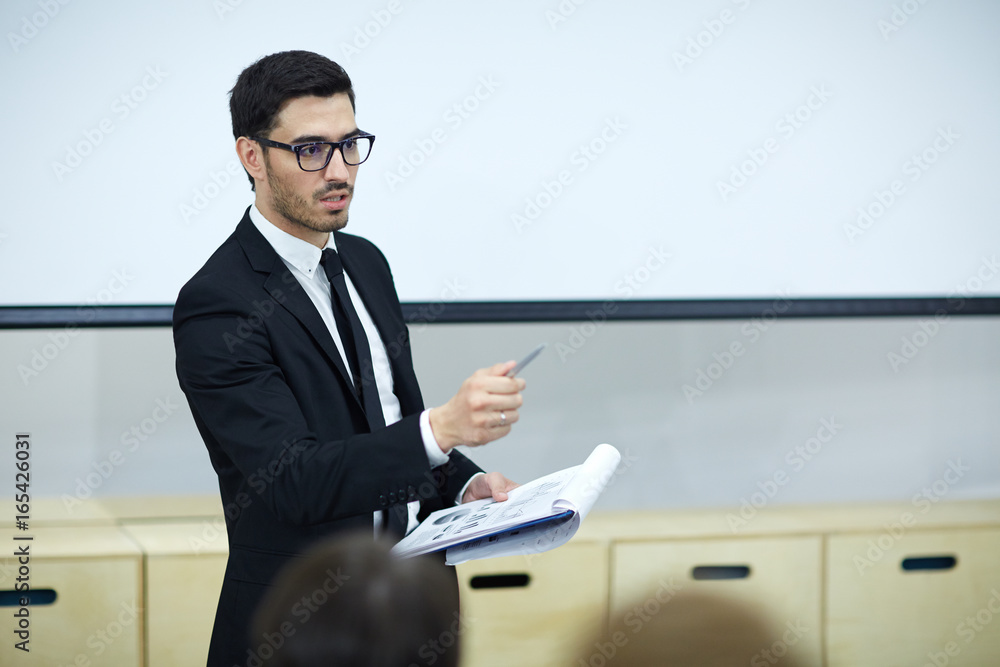 Confident trader making financial report at conference Confident trader making financial report at conference