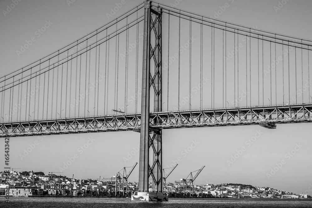 Fototapeta premium Famous 25th April Bridge over River Tajo in Lisbon aka Salazar Bridge