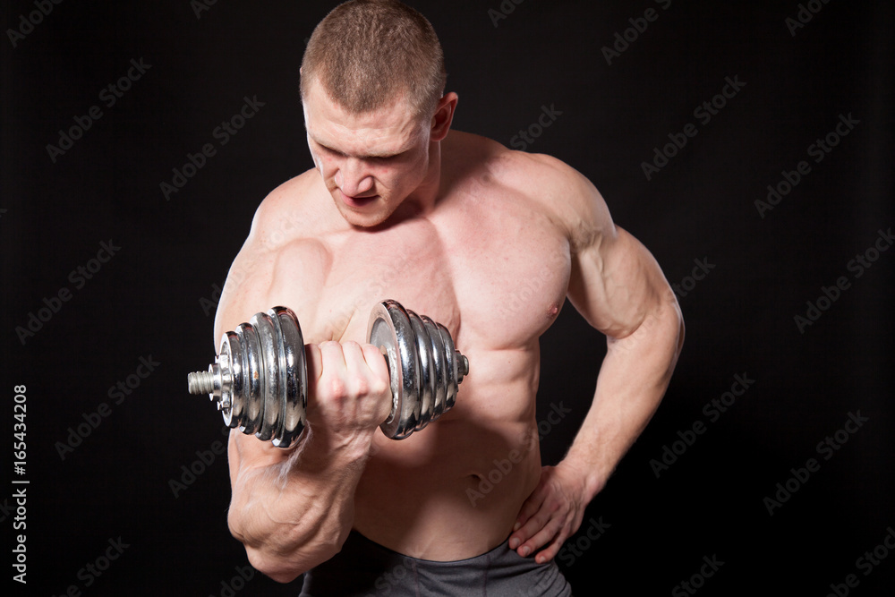 Sport the athlete bodybuilder build muscles dumbbells Sport the athlete bodybuilder build muscles dumbbells