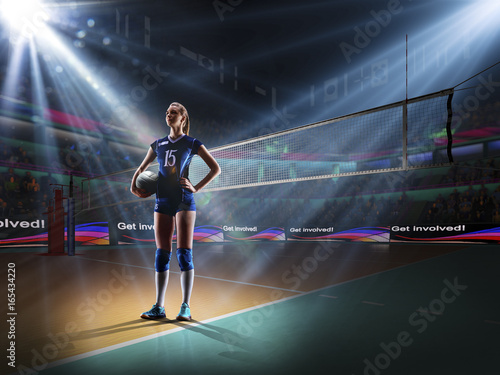 Female professional volleyball player on grand court