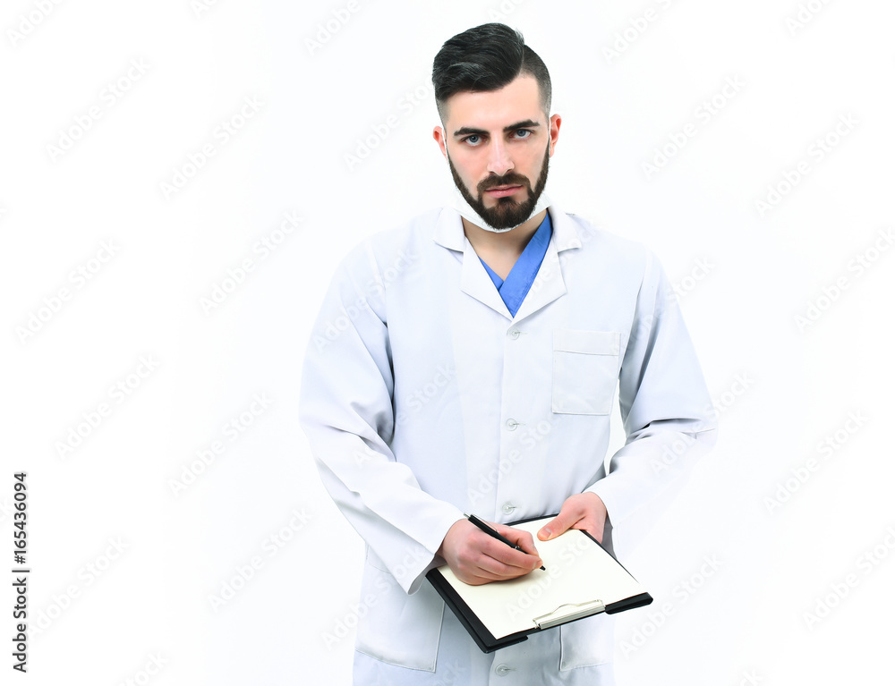 Treatment and ambulance service concept. Doctor with beard writes prescriptions