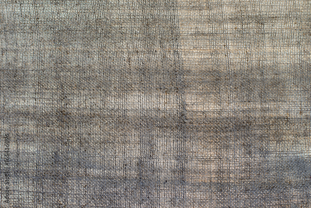Fototapeta premium Texture of an old dark linen cloth, background
