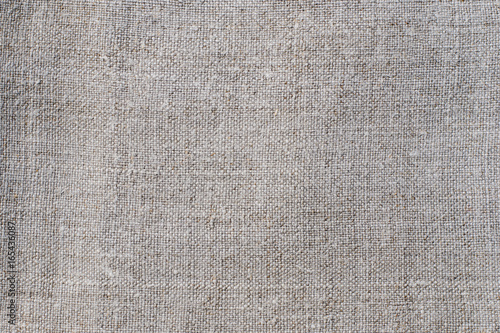 Texture of an old light linen cloth, background