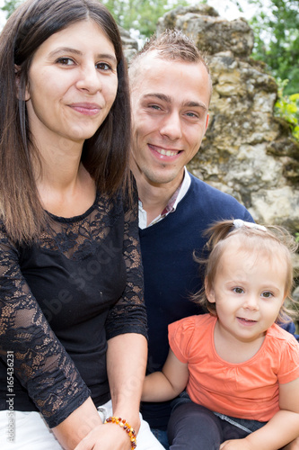 portrait of a happy family on the nature