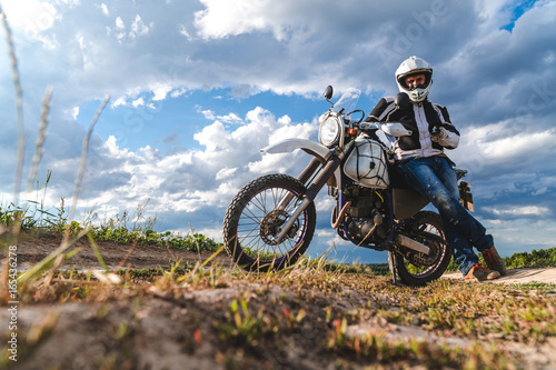 travel motorcycle off road Motorcyclist gear, A motorcycle driver looks, concept, active lifestyle, enduro © Sergey