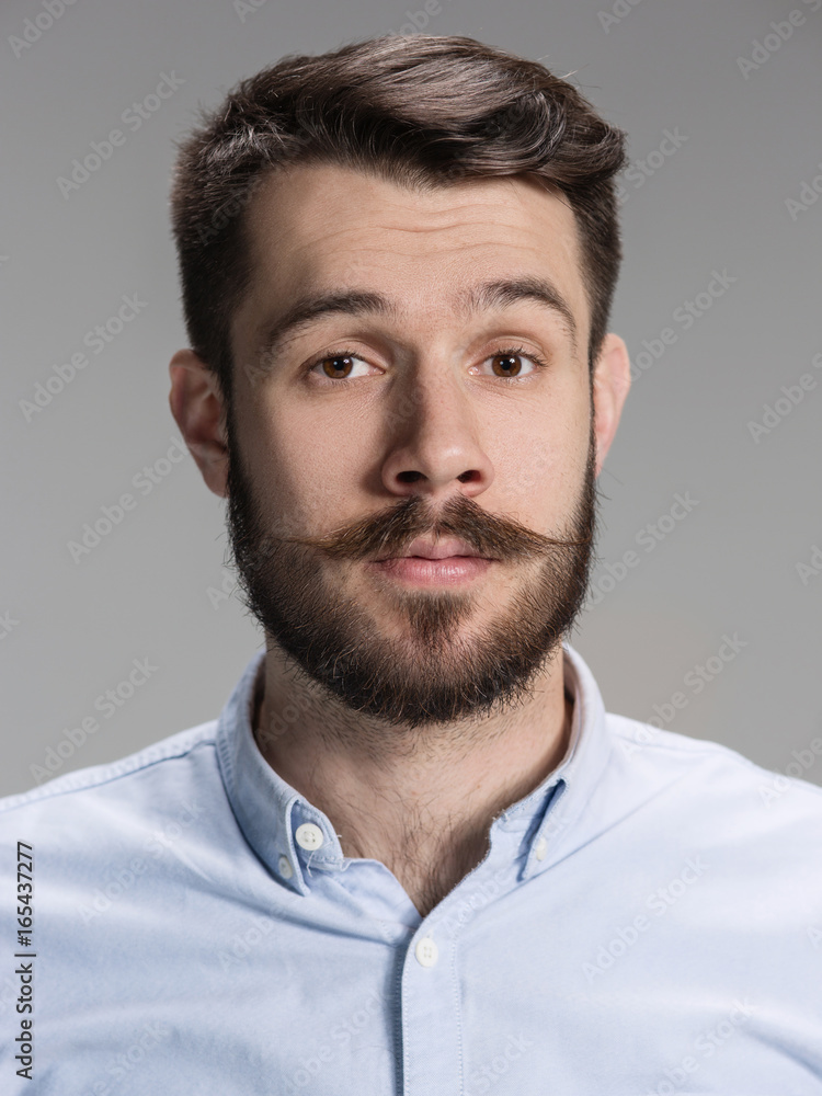 Obraz premium The young man looking at camera