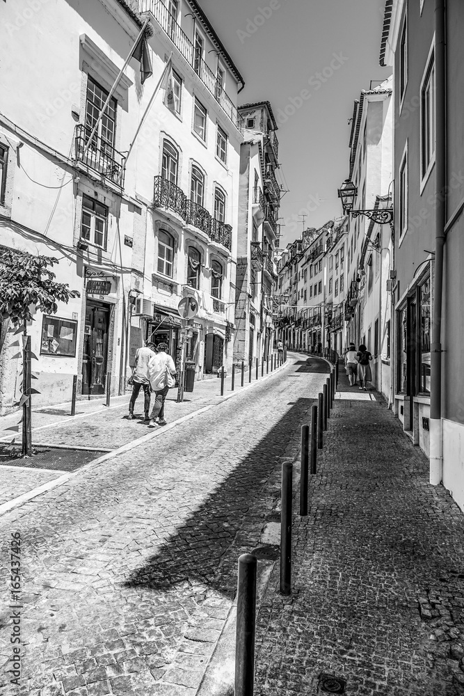Narrow streets in historic district of Lisbon - LISBON / PORTUGAL - JUNE 17, 2017