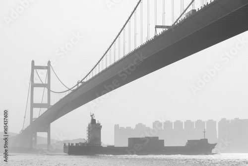 Cargo ship and Tsing Ma Bridge in Hong Kong © leeyiutung
