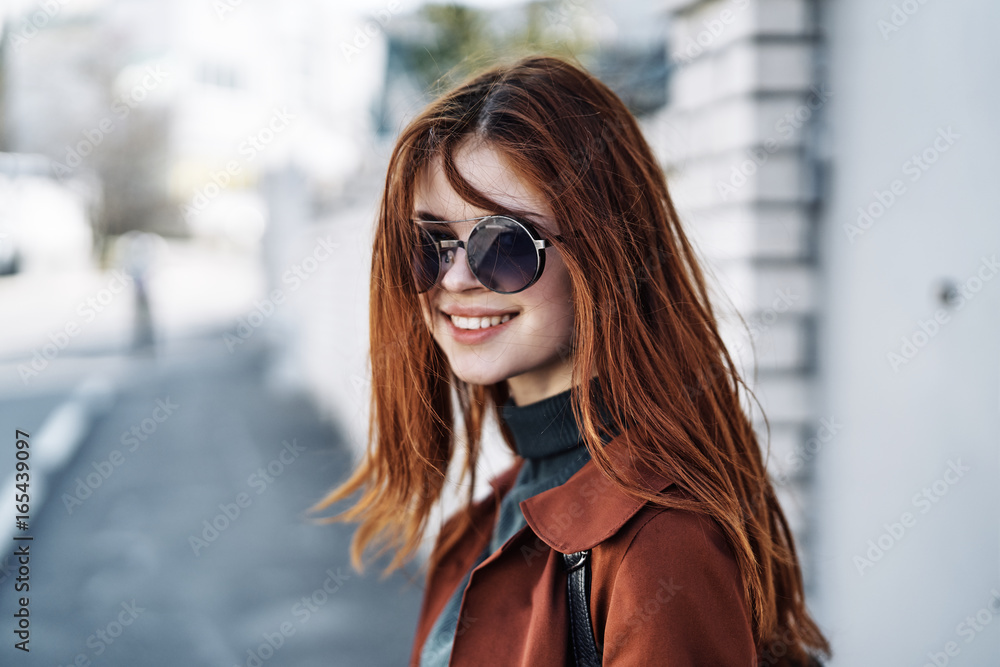 Young beautiful woman is walking outdoors in the city Young beautiful woman is walking outdoors in the city