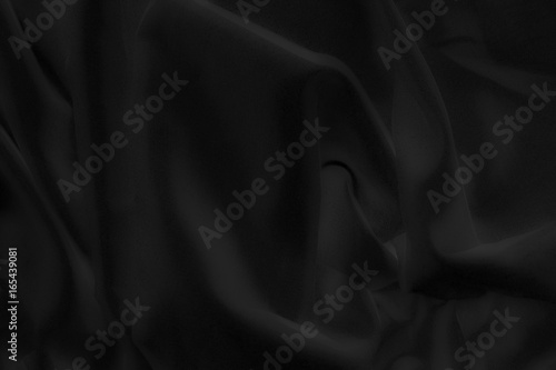 black cloth background abstract with soft waves.
