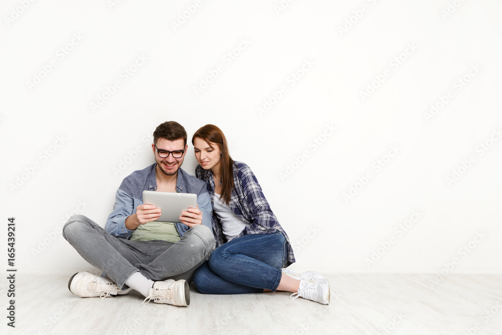 Couple planning design project for new apartment Couple planning design project for new apartment