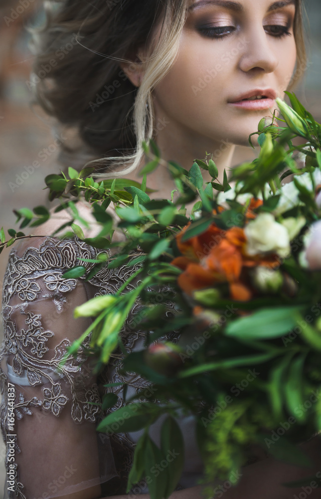 Stylish wedding couple with rustic bouquet. Toned and blurred image Stylish wedding couple with rustic bouquet. Toned and blurred image