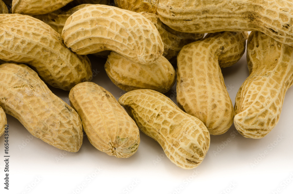 Macro closeup of Peanuts, isolated on white background Macro closeup of Peanuts, isolated on white background