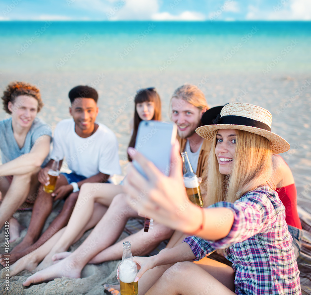 Happy group of friend makes a selfie with a mobile phone Happy group of friend makes a selfie with a mobile phone