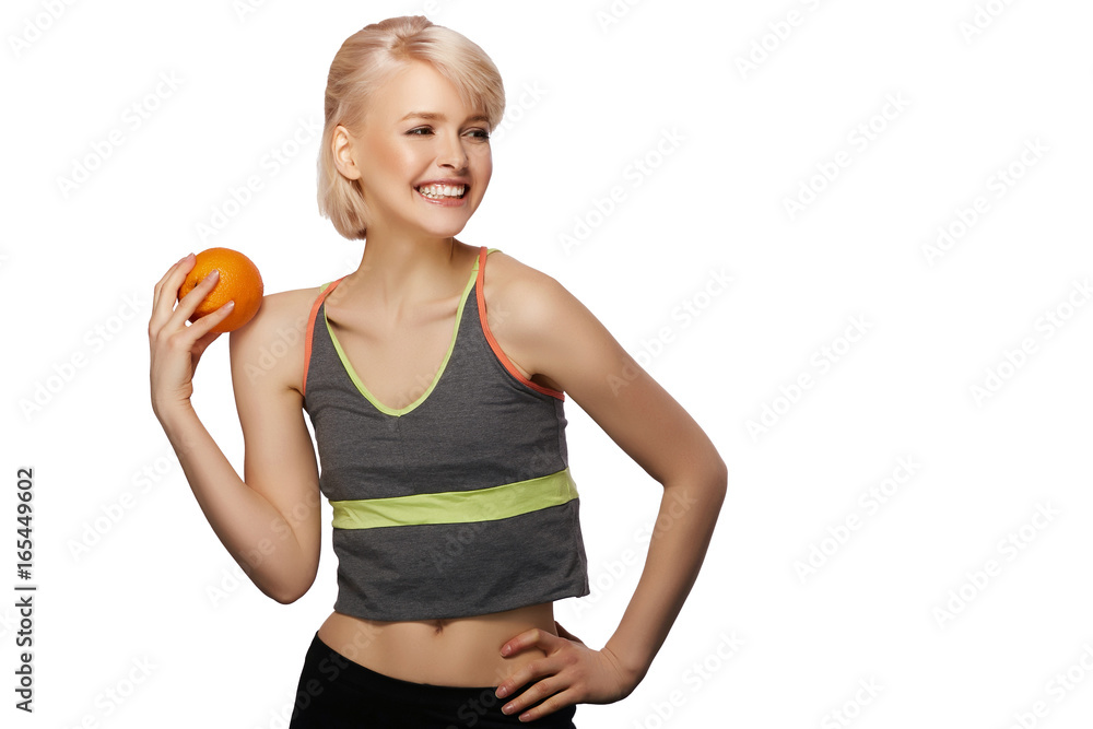 Happy smiling slim woman holding the orange, studio portrait isolated on white background, healthy lifestyle concept Happy smiling slim woman holding the orange, studio portrait isolated on white background, healthy lifestyle concept