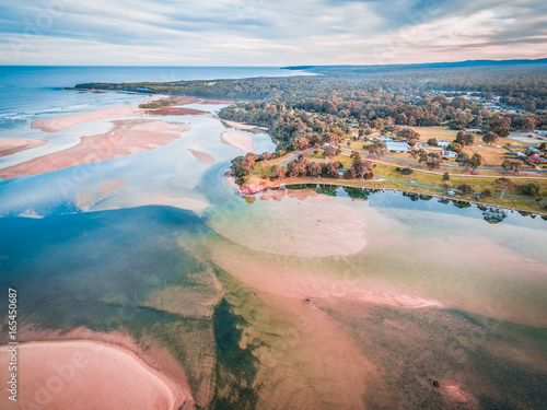 Aerial view of Mallacoota town and coastline at sunset in Australia photo