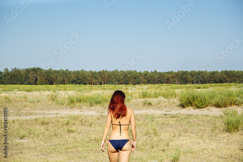 Beautiful girl on the beach in sun glasses 