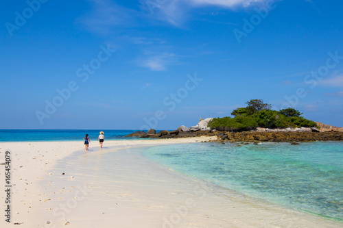 white sand beach and clear water and nice blue sky 