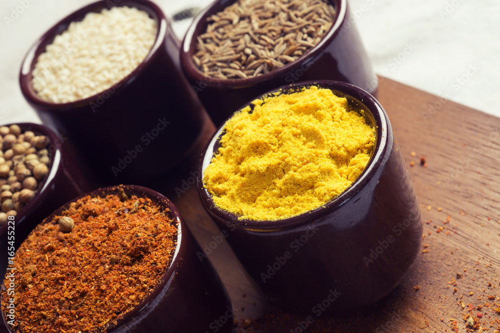 Spices and herbs in ceramic bowls. seasoning. Colorful natural additives. Spices and herbs in ceramic bowls. seasoning. Colorful natural additives.