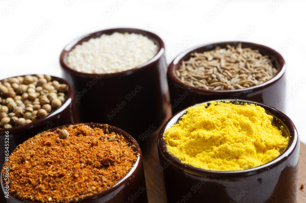 Spices and herbs in ceramic bowls. seasoning. Colorful natural additives. Spices and herbs in ceramic bowls. seasoning. Colorful natural additives.