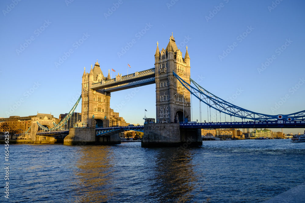Late afternoon winter sunshine on iconic Tower Bridge in London England
