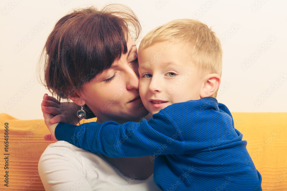 Mother hugging her son, little boy Mother hugging her son, little boy