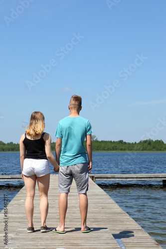Couple in love walking on the lake.