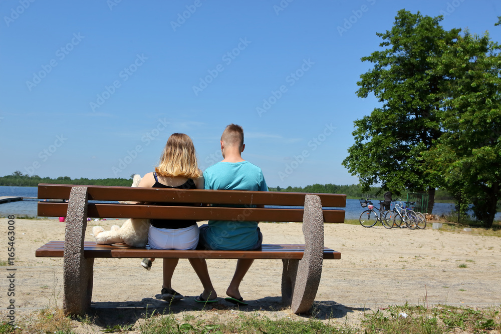 Teenagers on the couch at the lake with their favorite teddy friend.
Teenagers on the couch at the lake with their favorite teddy friend.