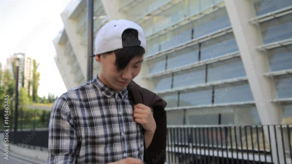 Handsome Asian student man typing smartphone urban Downtown Night Lights Communication Technology 4G Reception Texting Sms App Travel Application Social Network Blogger Handsome Asian student man typing smartphone urban Downtown Night Lights Communication Technology 4G Reception Texting Sms App Travel Application Social Network Blogger