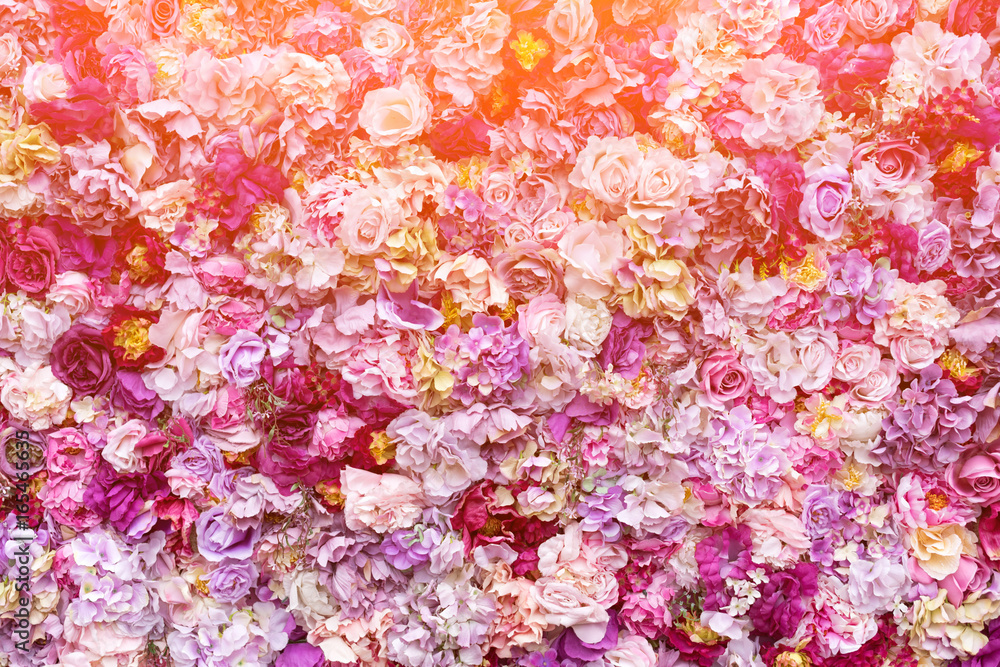 Flower texture background for wedding scene. Roses, peonies and hydrangeas, artificial flowers on the wall.