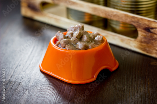 Canned pet food in a orange...