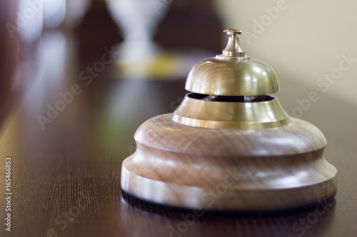 Service bell in a hotel reception for concierge alarm on desk.