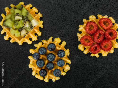 Belgian Butter Waffles With Blueberries Raspberries and Kiwi Fruit