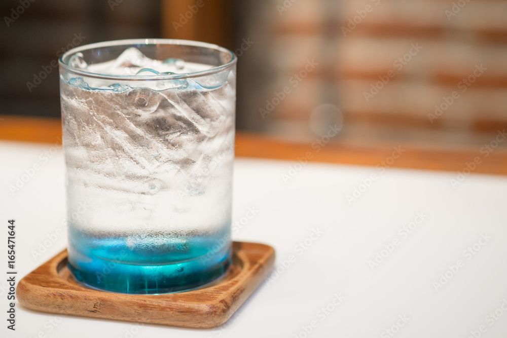 Glass of water with ice on the white table at restaurant. Glass of water with ice on the white table at restaurant.