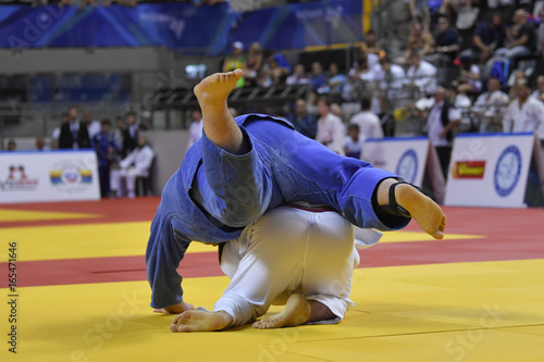Male Judoka fighters during Judo competition 