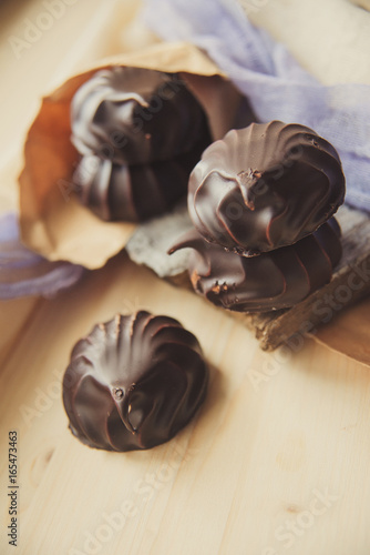 small chocolate-covered cream cake photo