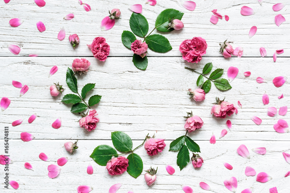 round frame flower pattern with roses flowers, buds, petals, branches and leaves round frame flower pattern with roses flowers, buds, petals, branches and leaves