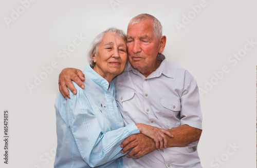 The elderly couple on studio background